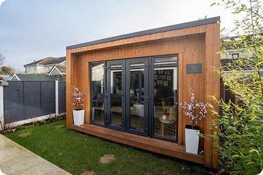 Modern garden studio with black-framed glass doors